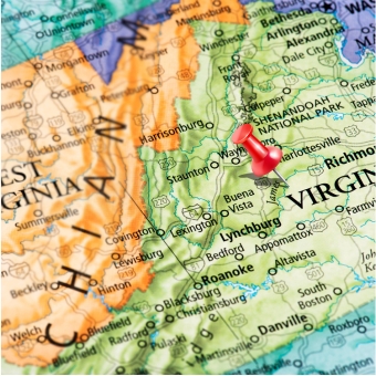 Mape of West Virginia and Virginia with a push pin in Virginia