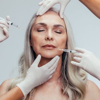 Image of an older female getting a fascial.