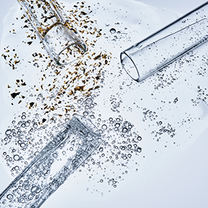 Three test tubes with spilled serums. Demonstration of textures.
