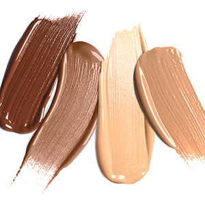 Foundation of various shades for different skin tones isolated on white, top view.