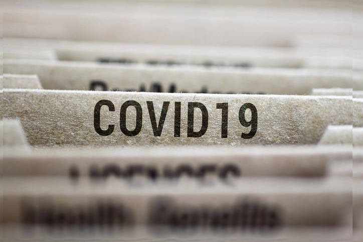 Financial folders with one folder boldy labeled Covid-19