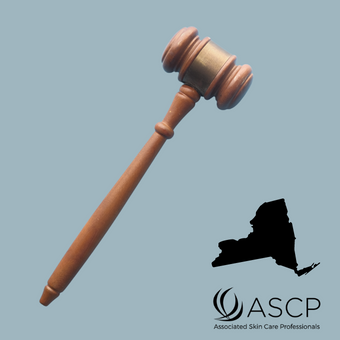 Brown gavel over grey blue background with shape of New York