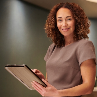 Esthetician holding an intake form