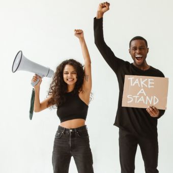 Two individuals advocating with a megaphone and sign