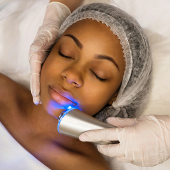 African American woman receiving an ultrasonic/LED facial service