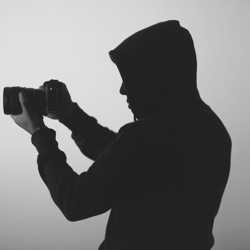 silhouette of man with camera