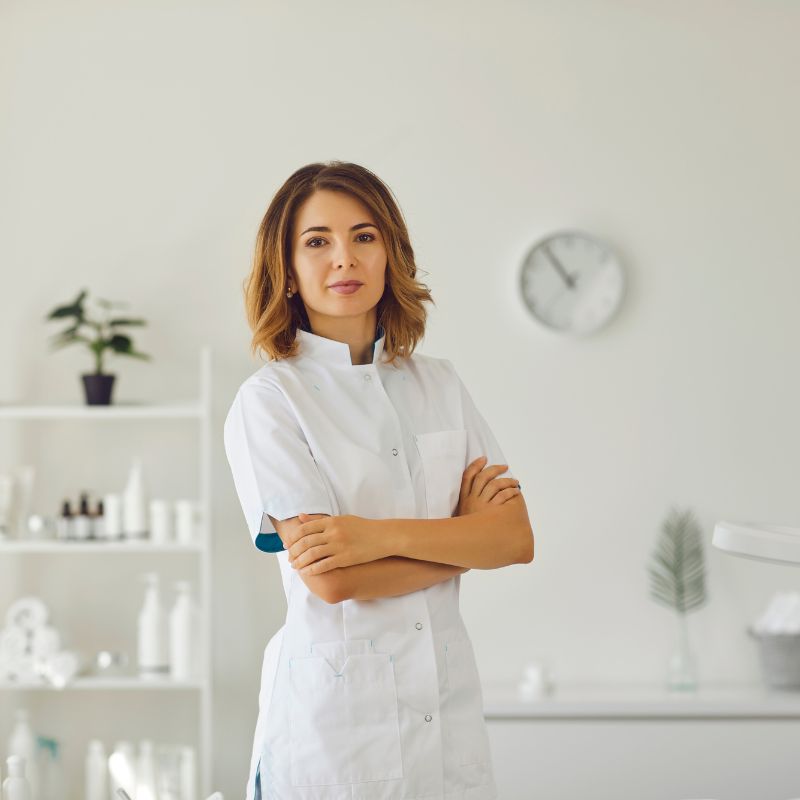 esthetician standing in treatment room