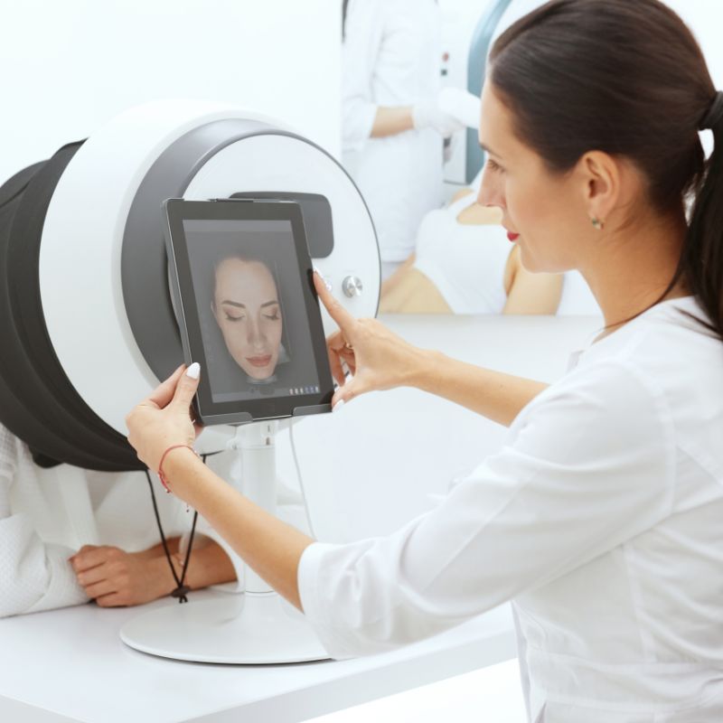 esthetician using a skin scanner