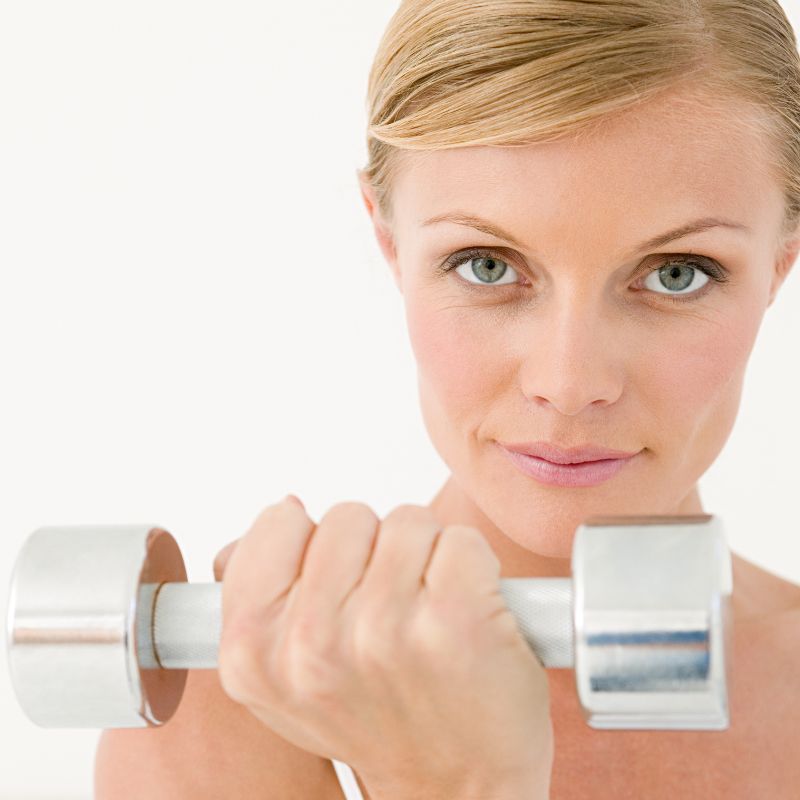 Woman holding dumbbell