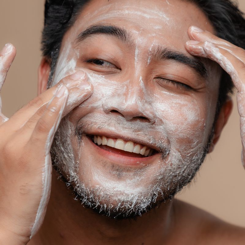 Image of a man using face cream.