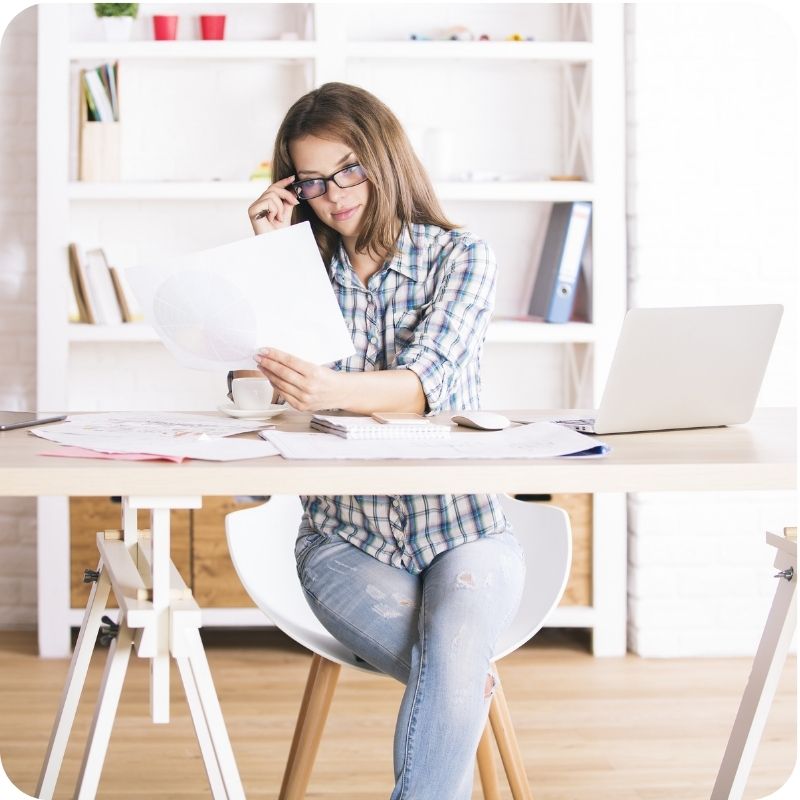 Image of a person working at their desk.