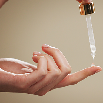 Image of an eye dropper with retinol application.