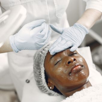 Image of a person receiving a cosmetic treatment.