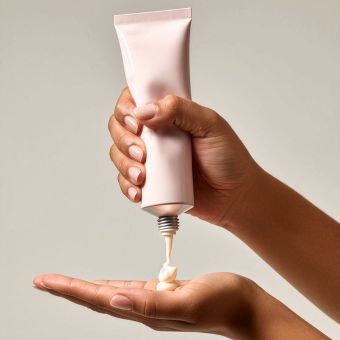 Image of hydrating lotion being squeezed from a bottle.
