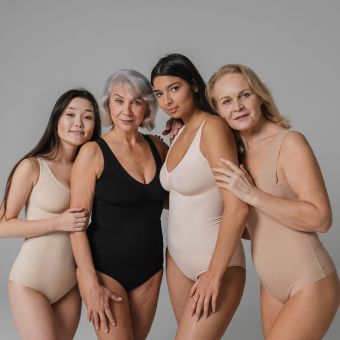Image of four women standing next to each other.