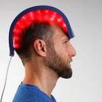 man with led light therapy on head