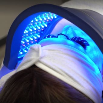 client receiving LED light therapy