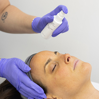 Esthetician neutralizing skin after a chemical Peel