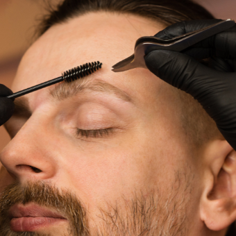 Male client get's his brows done