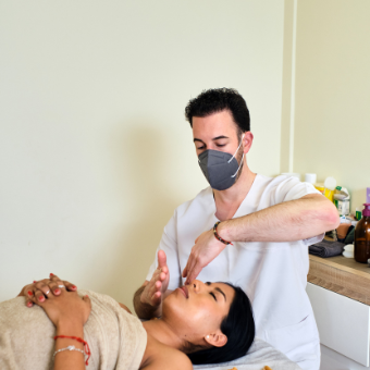 Male esthetician does facial massage