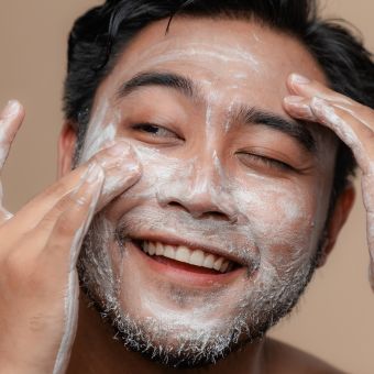 Man washing his face