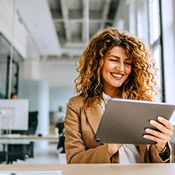 woman looking at tablet computer