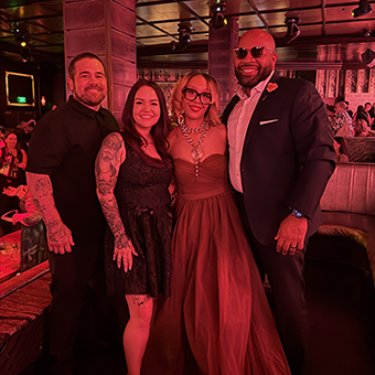 Four people pose for a photo at the 2026 ASCP Esty of the Year awards ceremony.